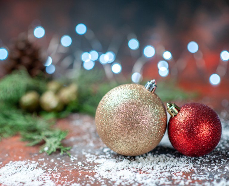 Front view xmas tree balls coconut powder on dark xmas lights